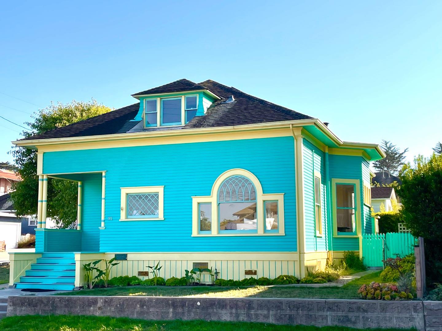 a front view of a house with garden