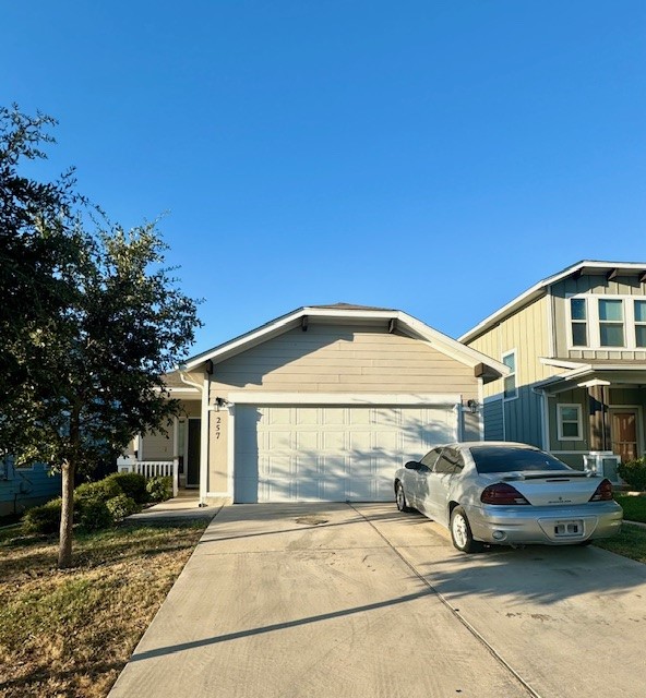 a view of a car parked in front of a house