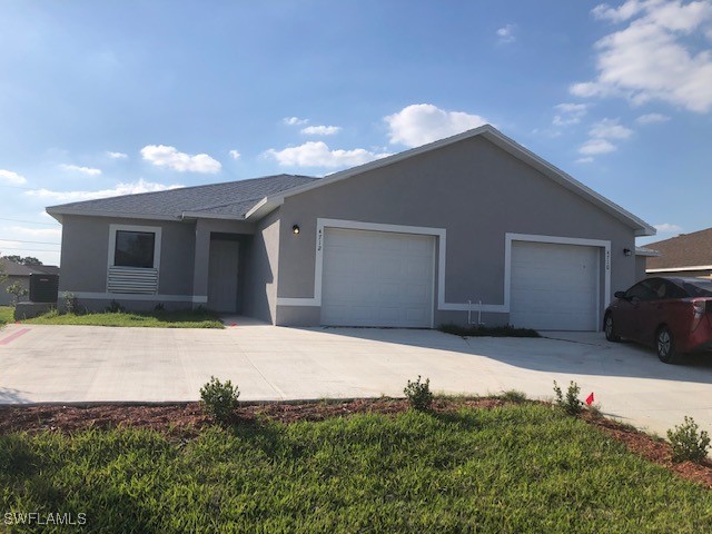 a house with yard in front of it