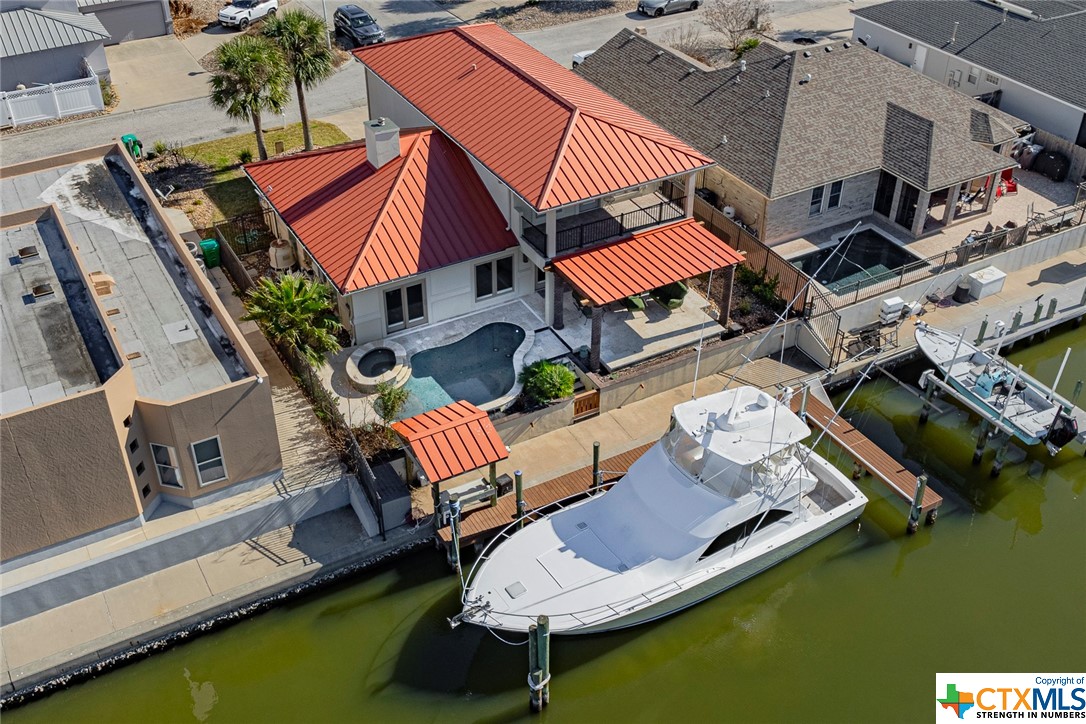 an aerial view of a house with swimming pool