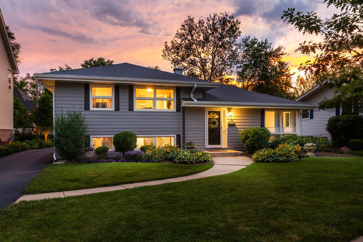 a front view of a house with a yard