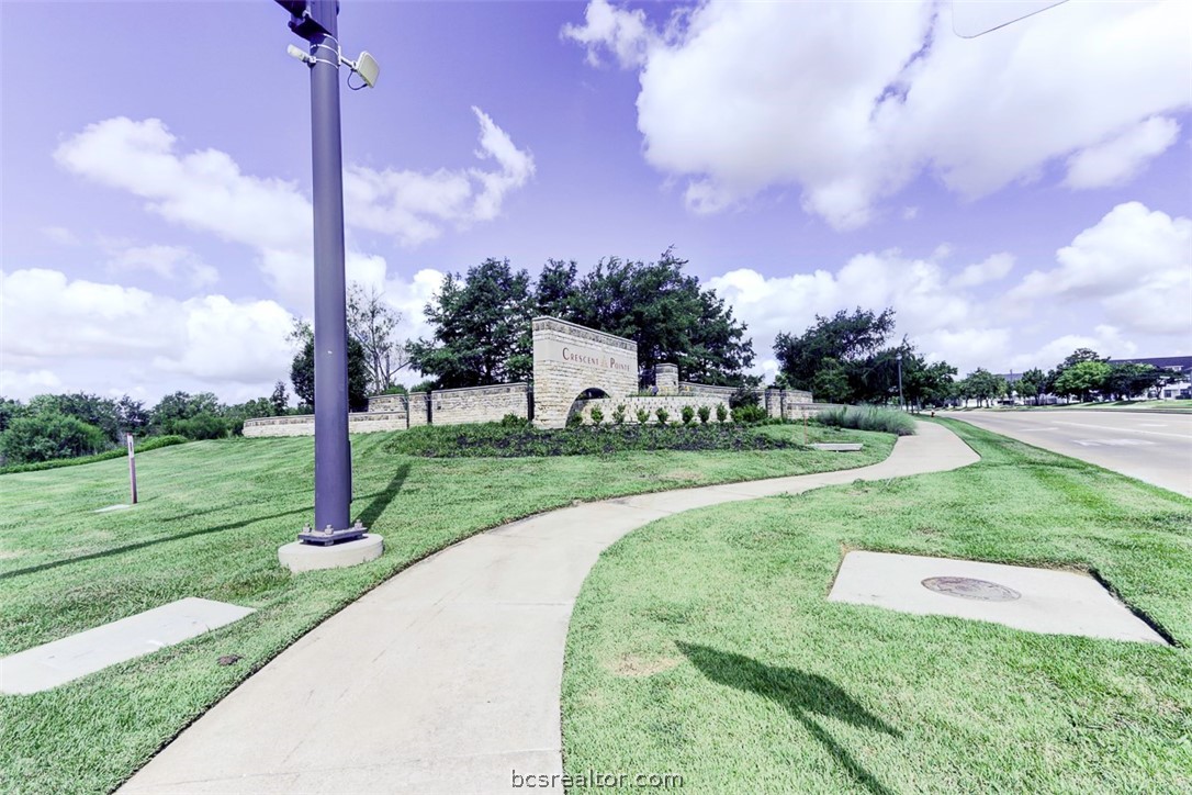 a view of a park with houses