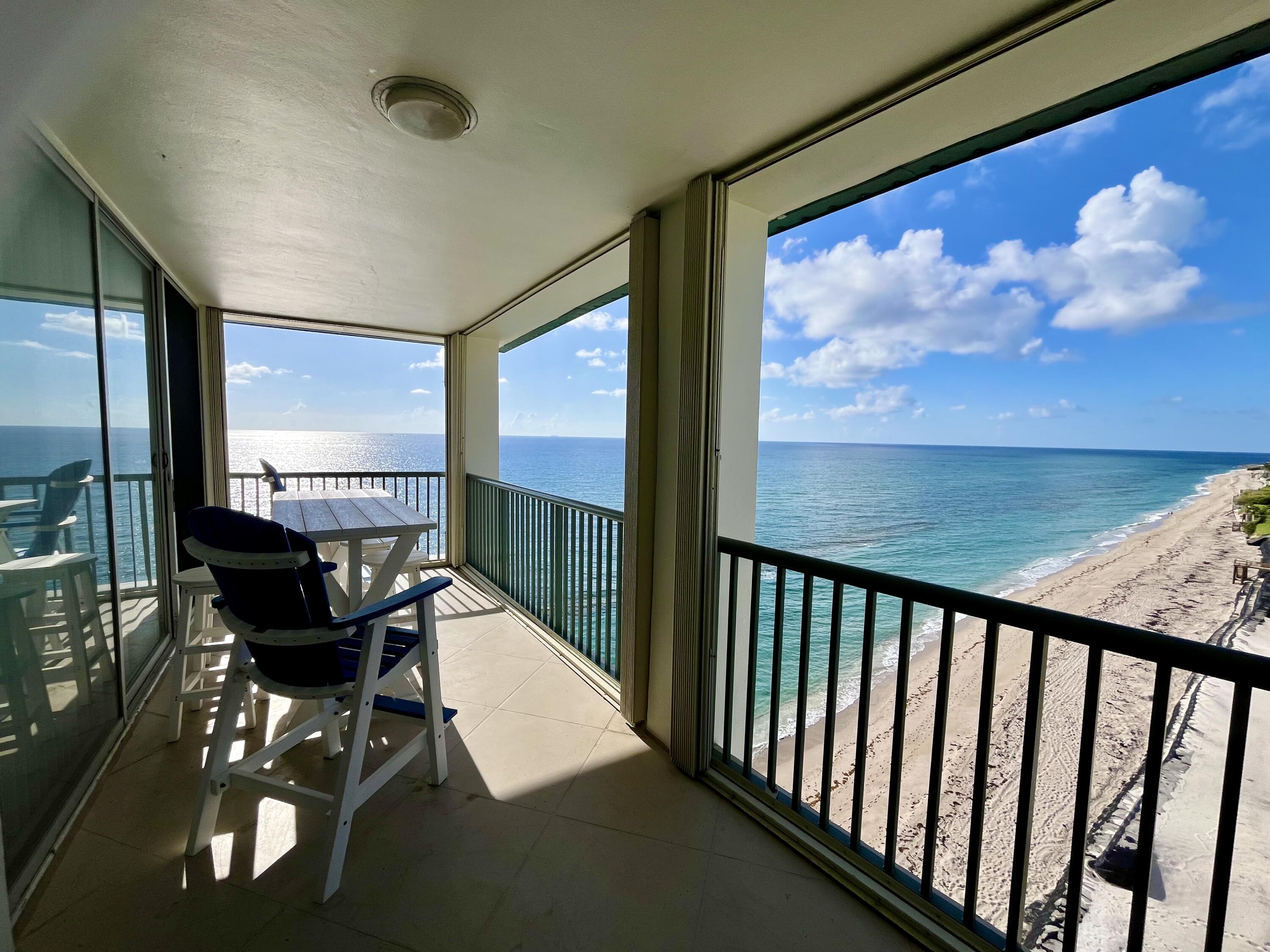 a view of a balcony with chairs