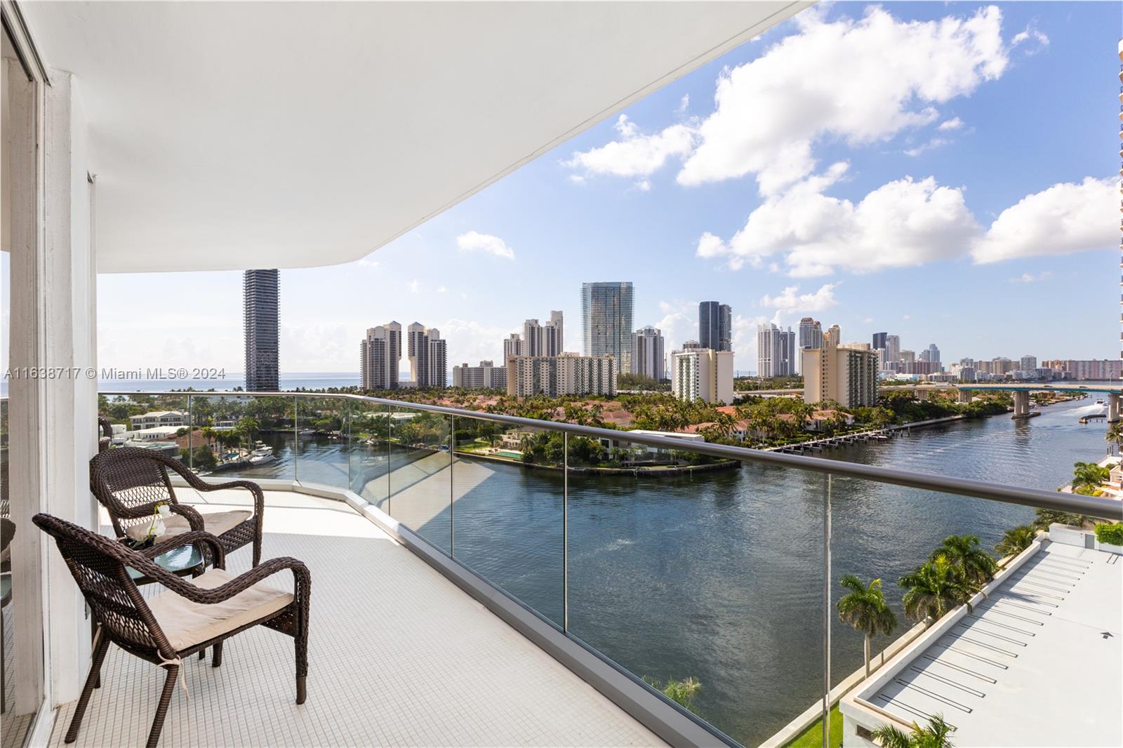 a view of swimming pool with outdoor seating and city view