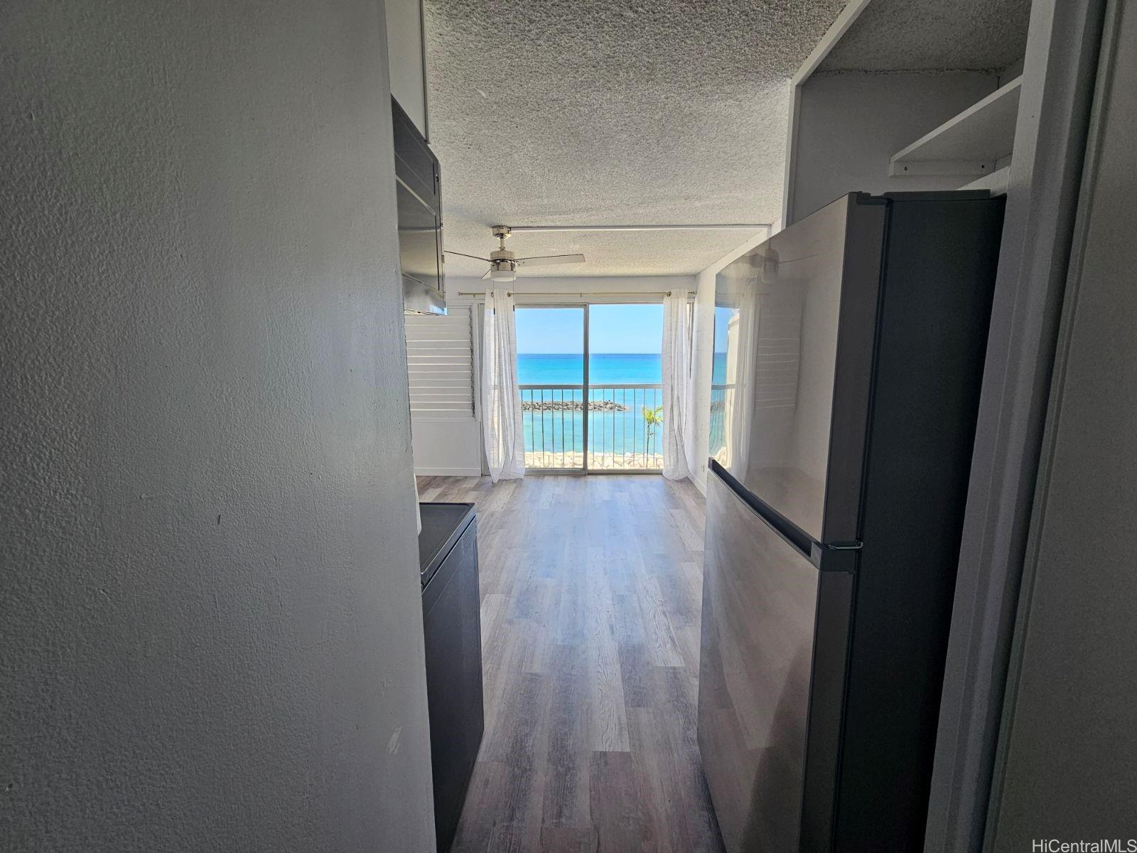 a view of wooden floor in an empty room