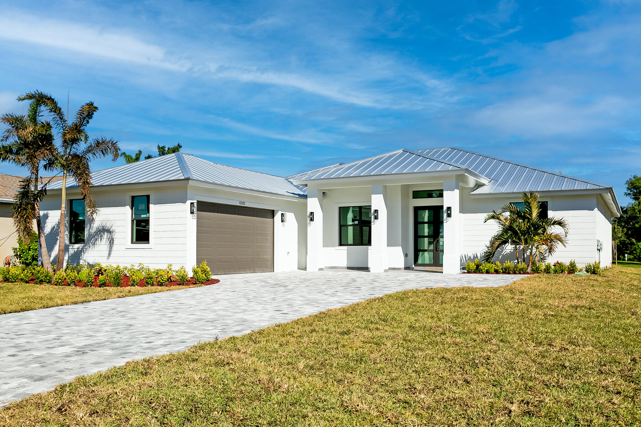 a front view of a house with a porch