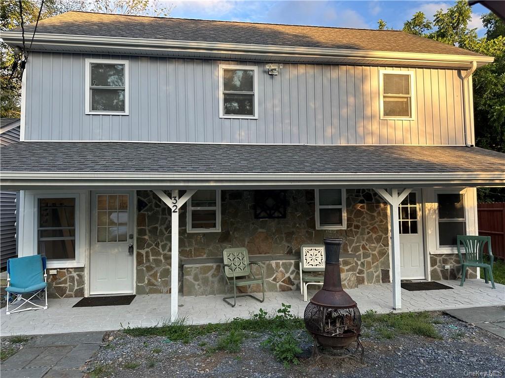 a front view of a house with patio