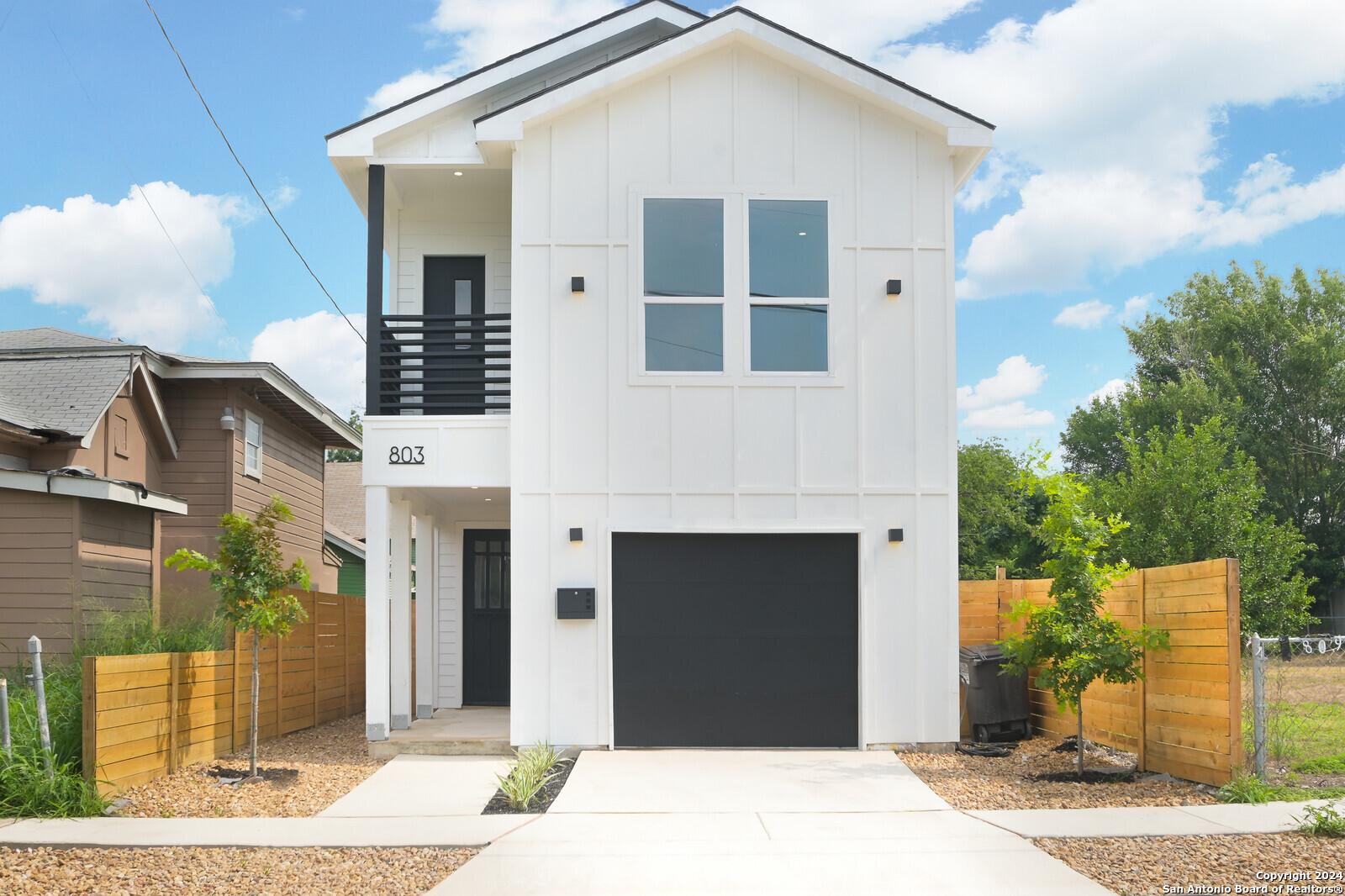 a front view of a house with yard