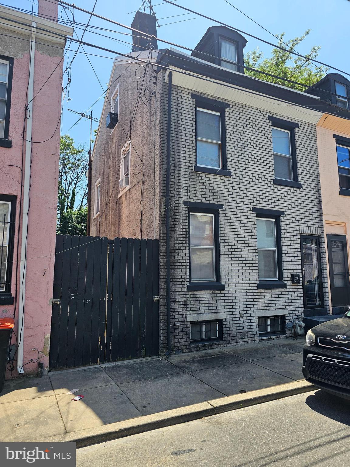 a view of a brick house with many windows