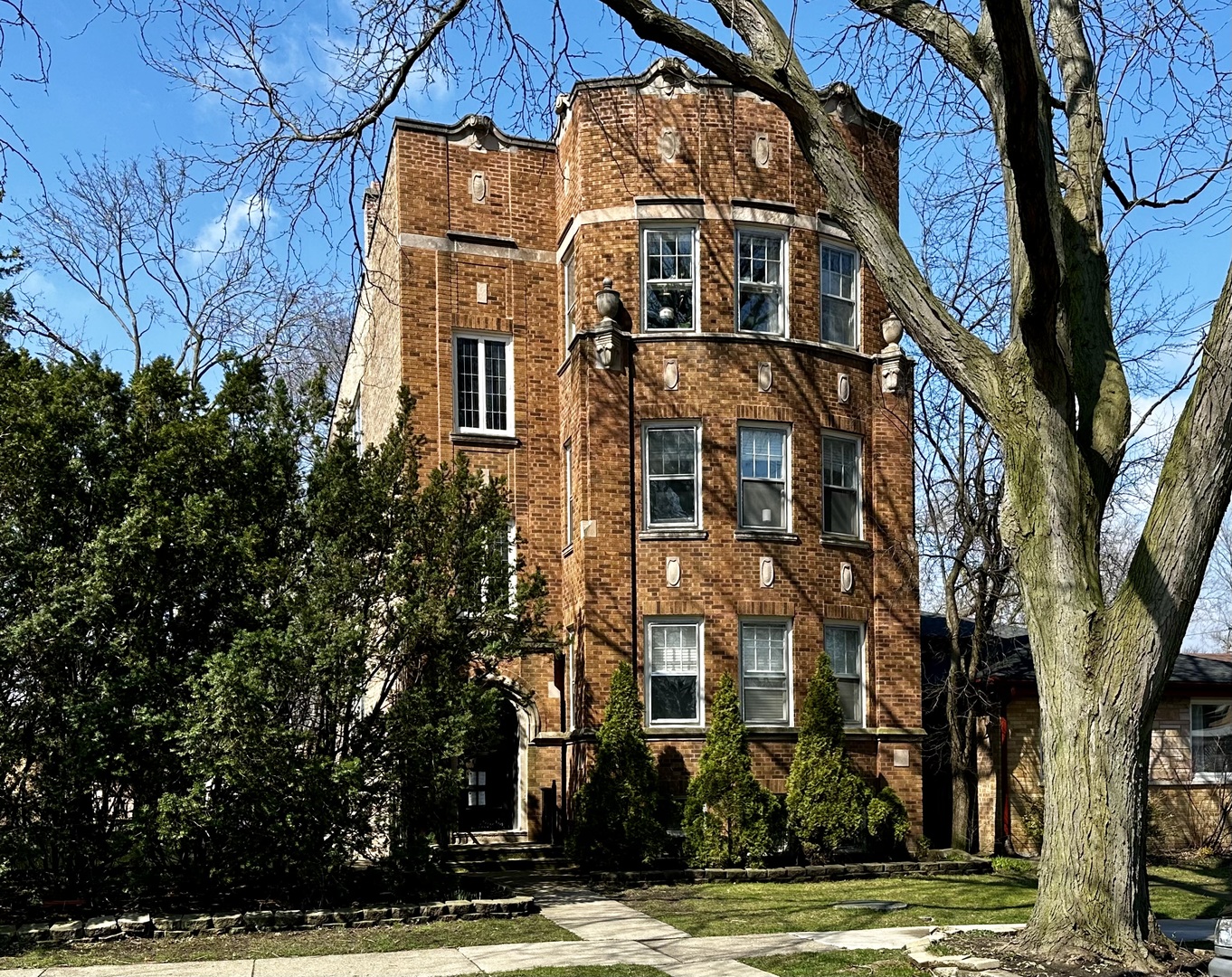 a view of a building with a tree