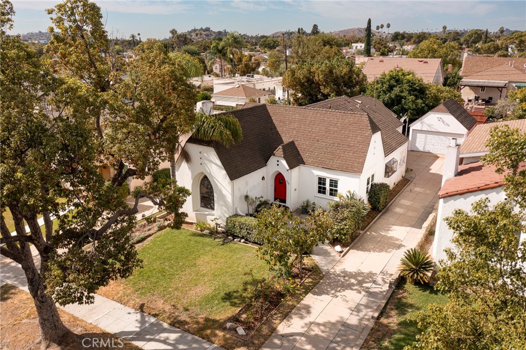 an aerial view of residential houses with outdoor space