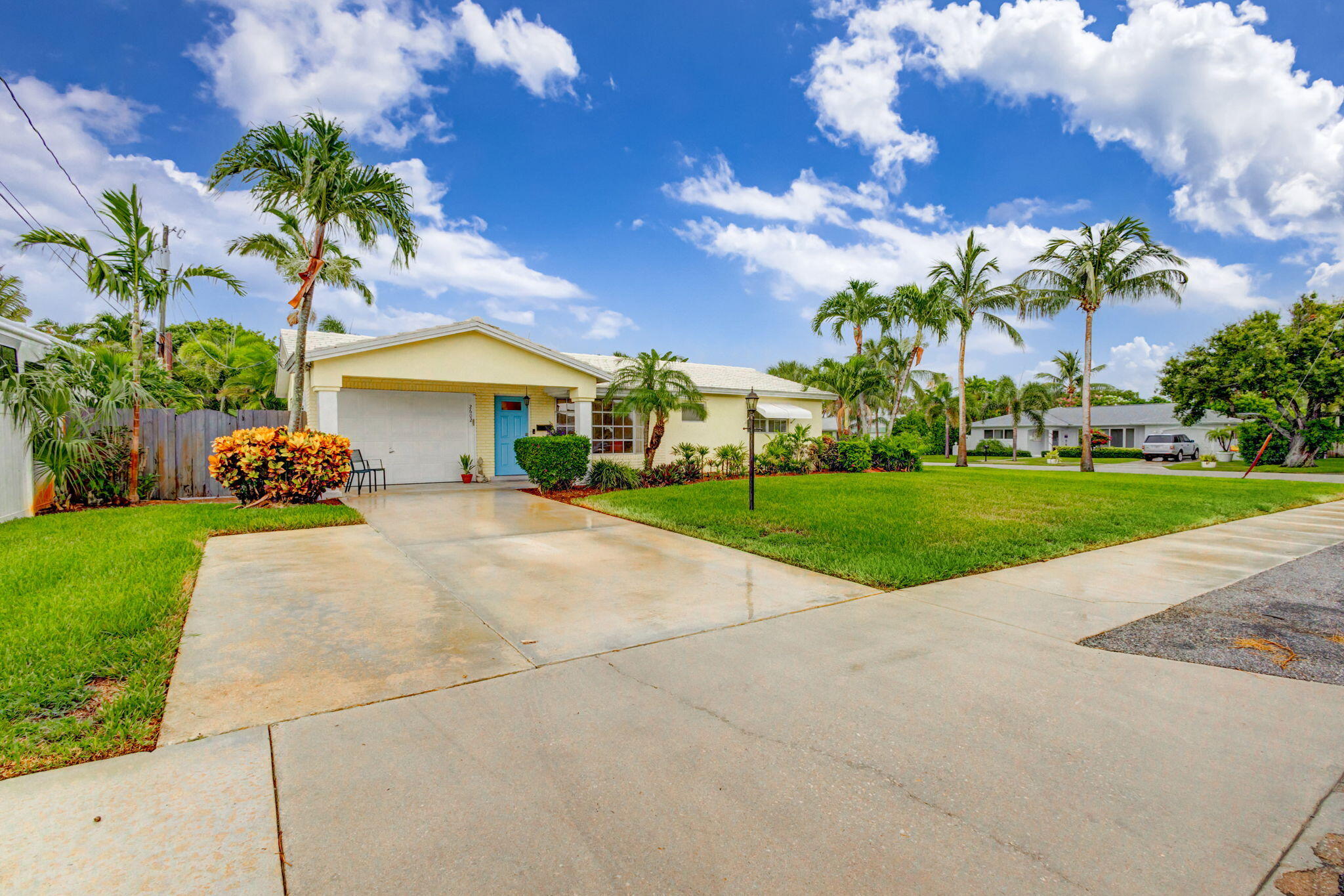 a view of house with outdoor space and swimming pool