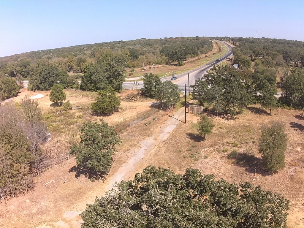 a view of a mountain with a yard