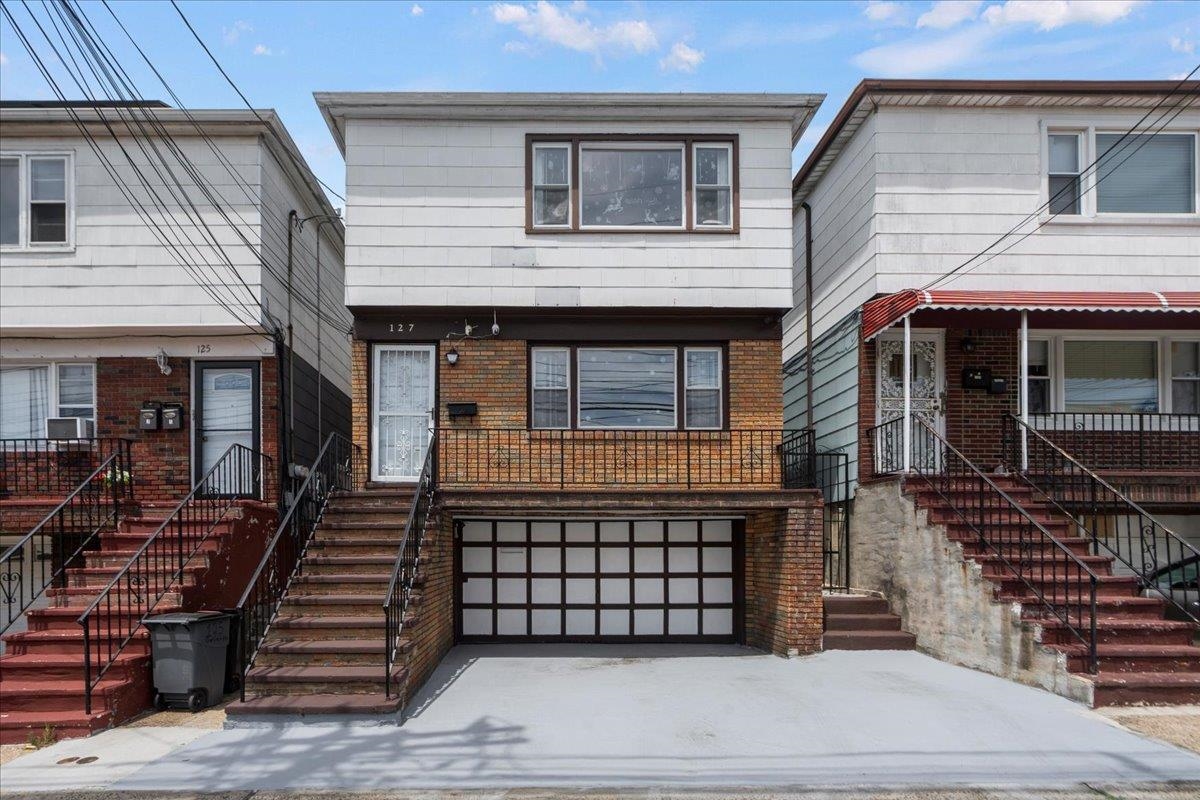 a front view of a house with stairs