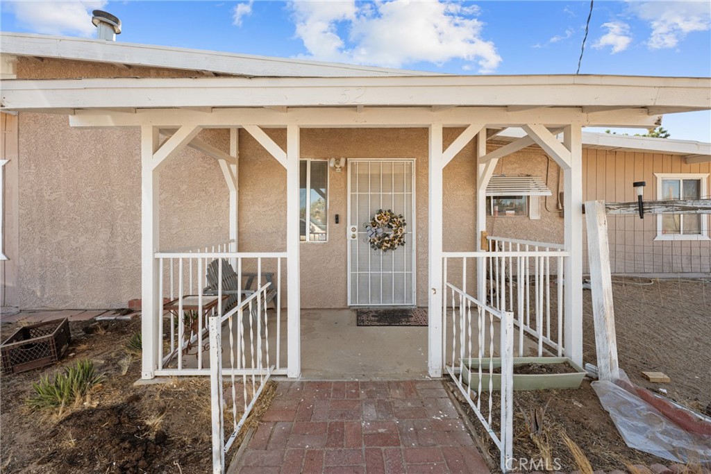 a view of entryway with a front door and wooden floor