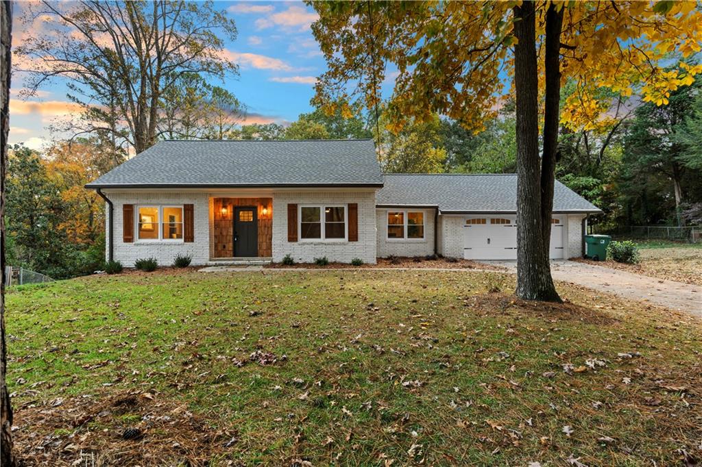 front view of a house with a yard