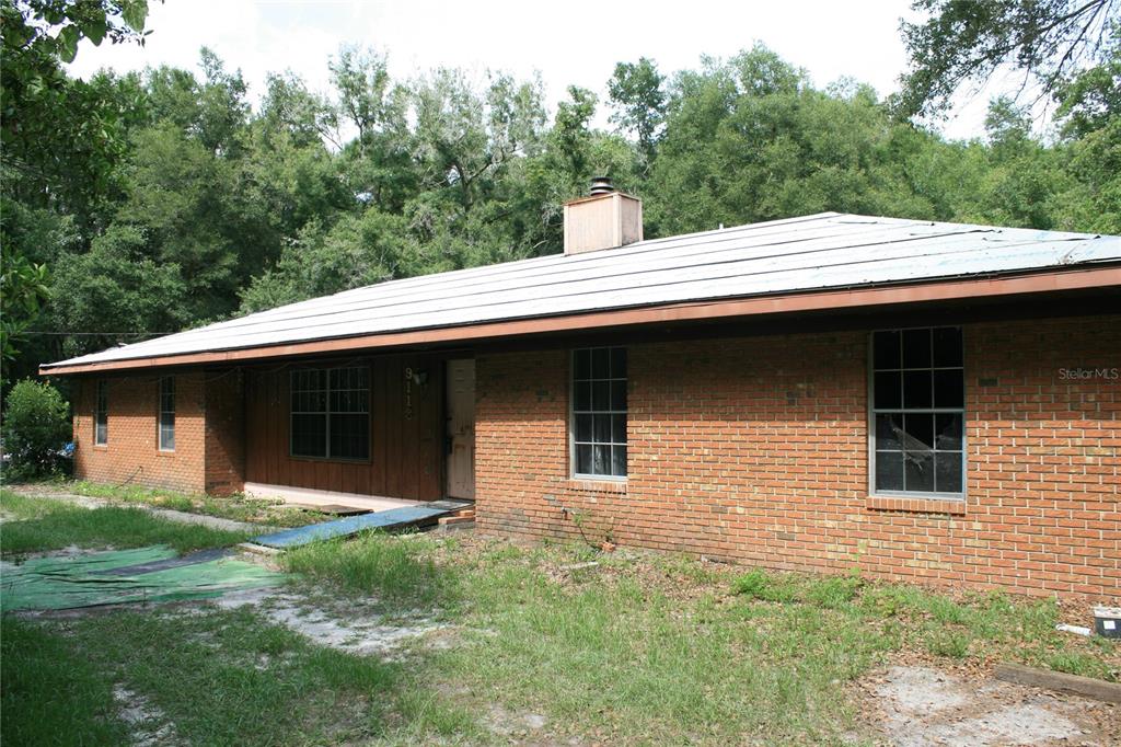 a front view of a house with yard