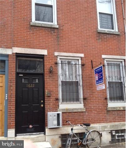 a brick house with a door and a door