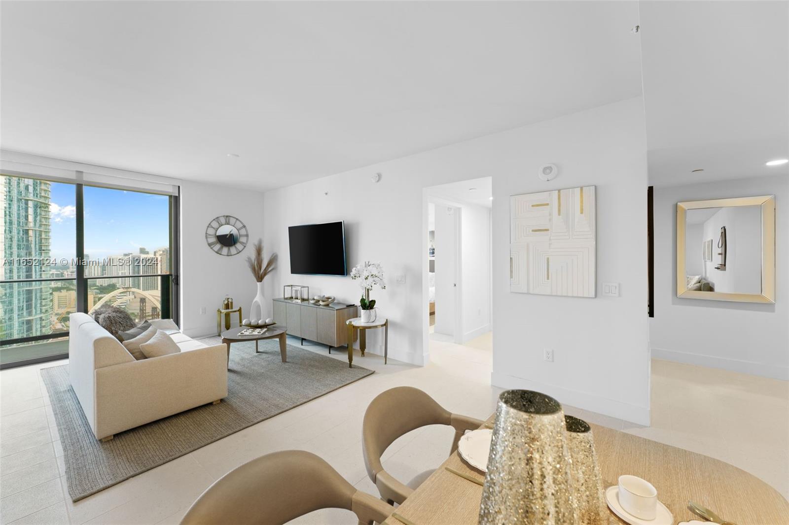 a living room with furniture and a flat screen tv