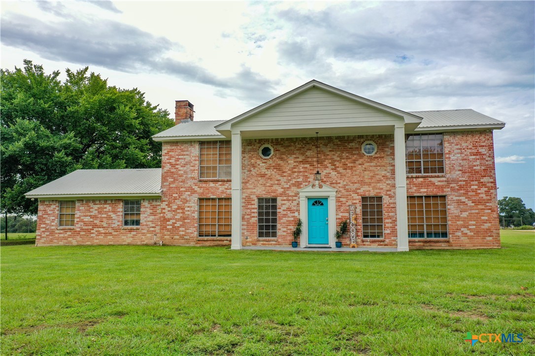 front view of a house with a yard