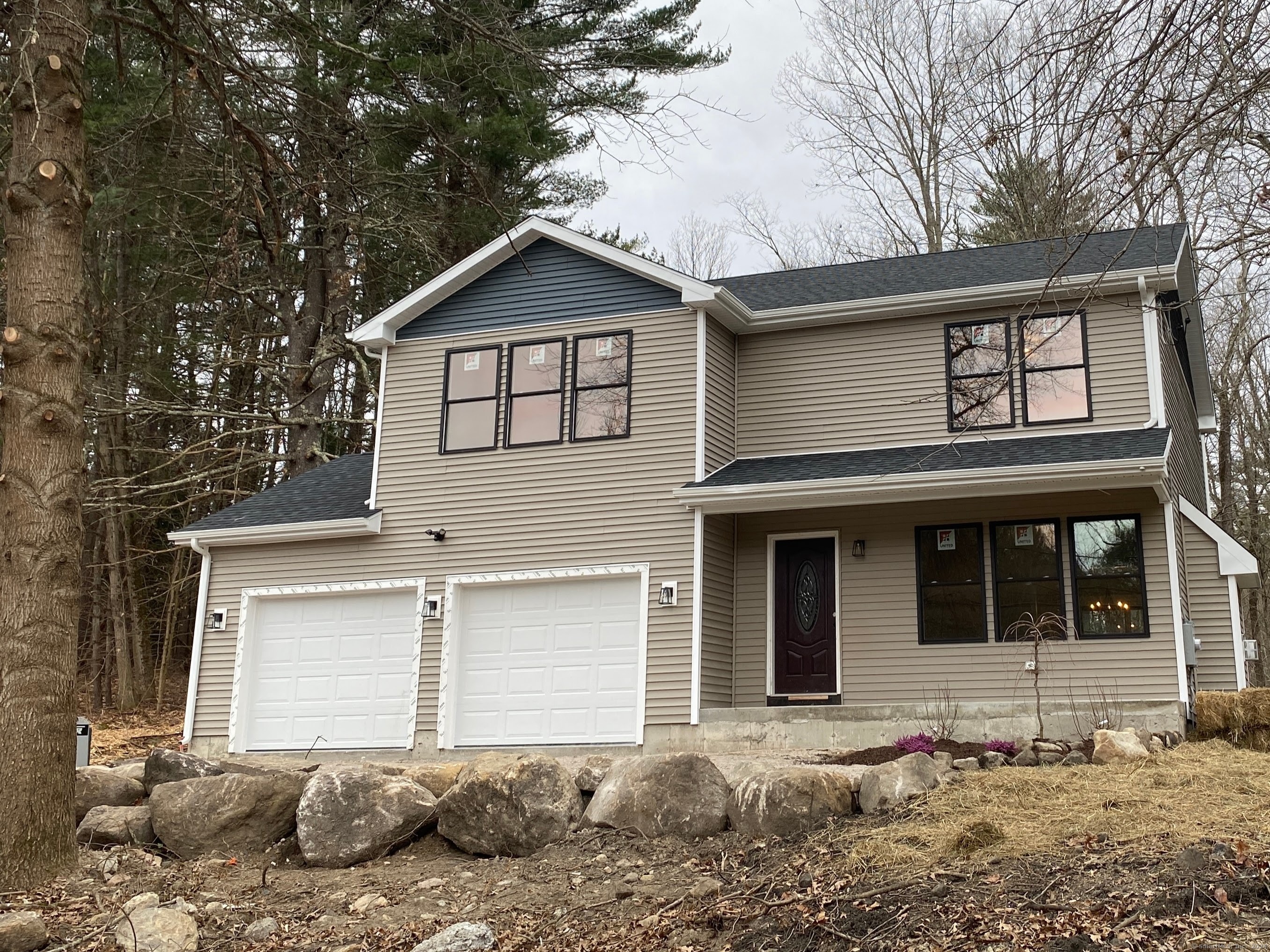 a front view of a house with a yard