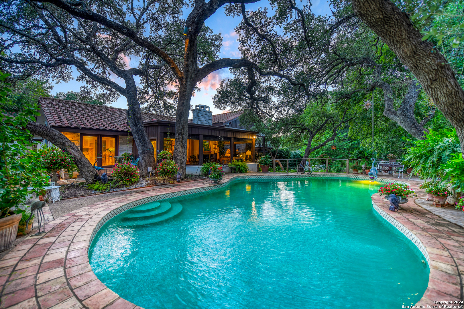 a swimming pool with outdoor seating and yard