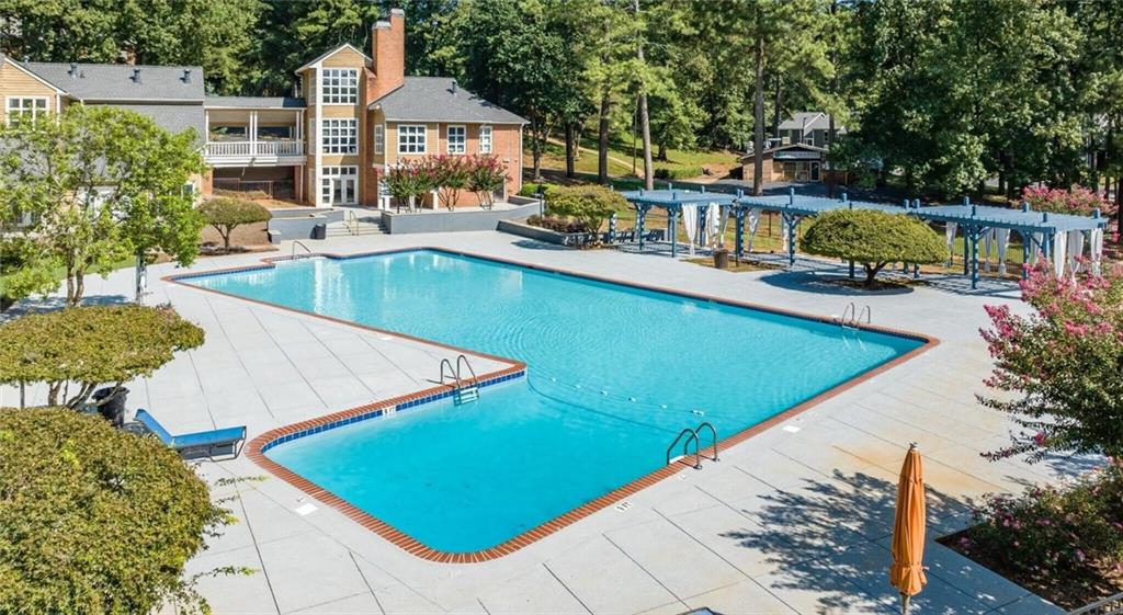 a view of a swimming pool with a patio