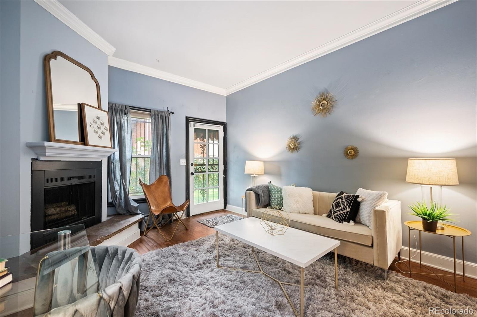 a living room with furniture rug and window