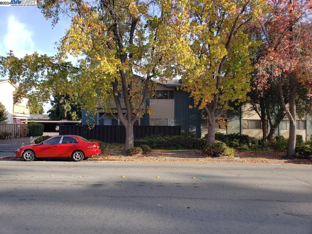 a view of street with parked cars