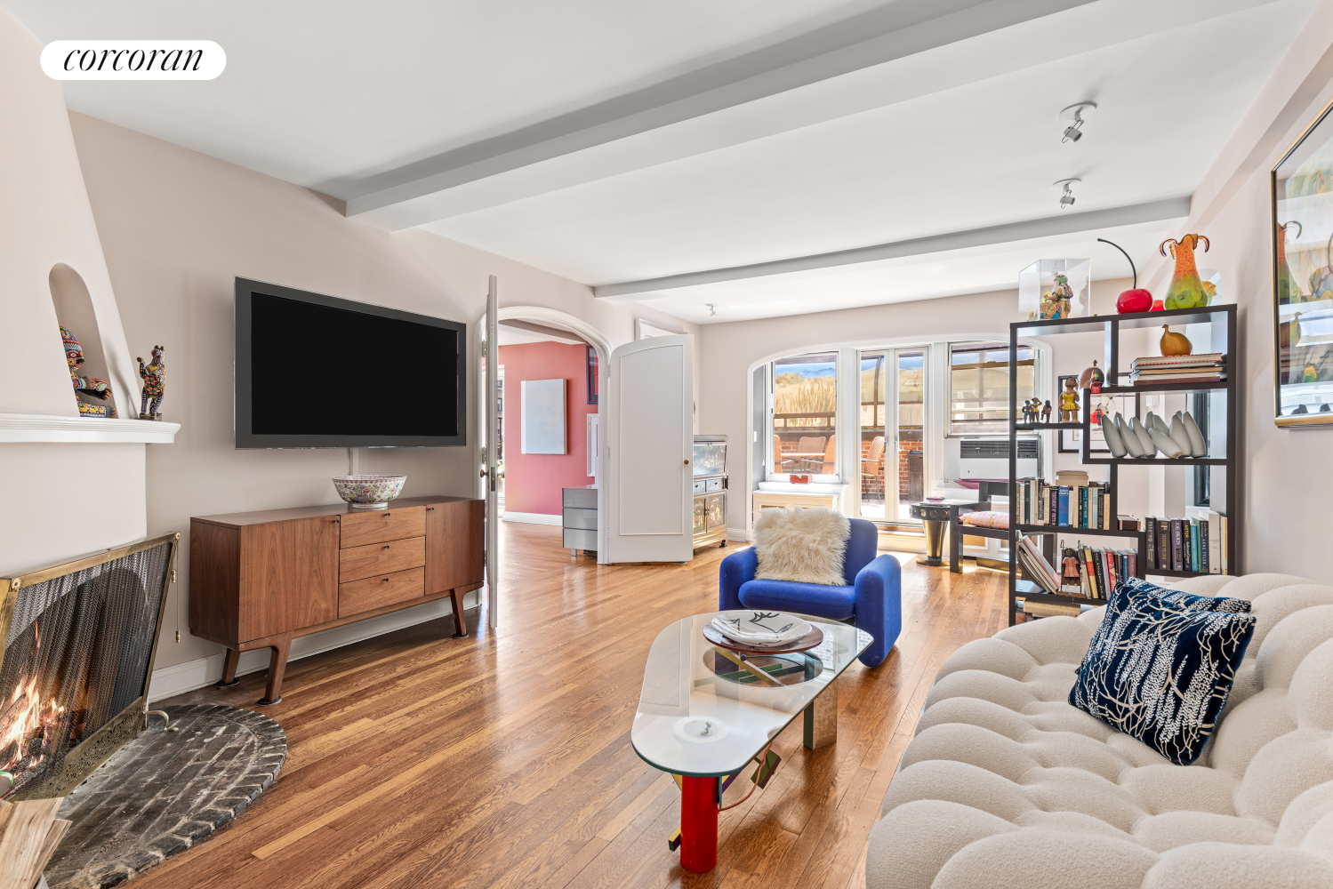 a living room with furniture and a flat screen tv