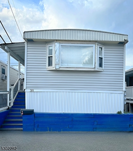 a view of a house with wooden deck