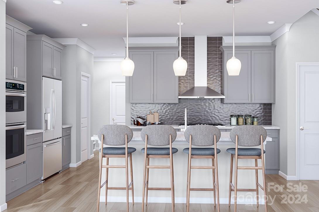 a kitchen with cabinets and chairs