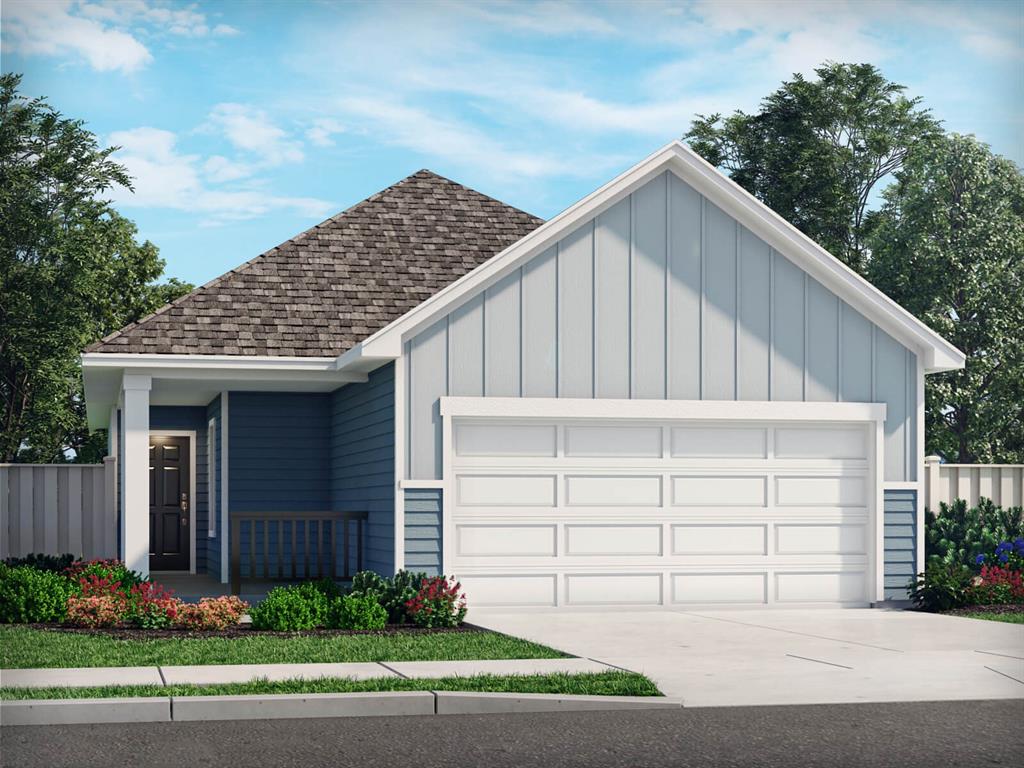 a view of a small house with garage