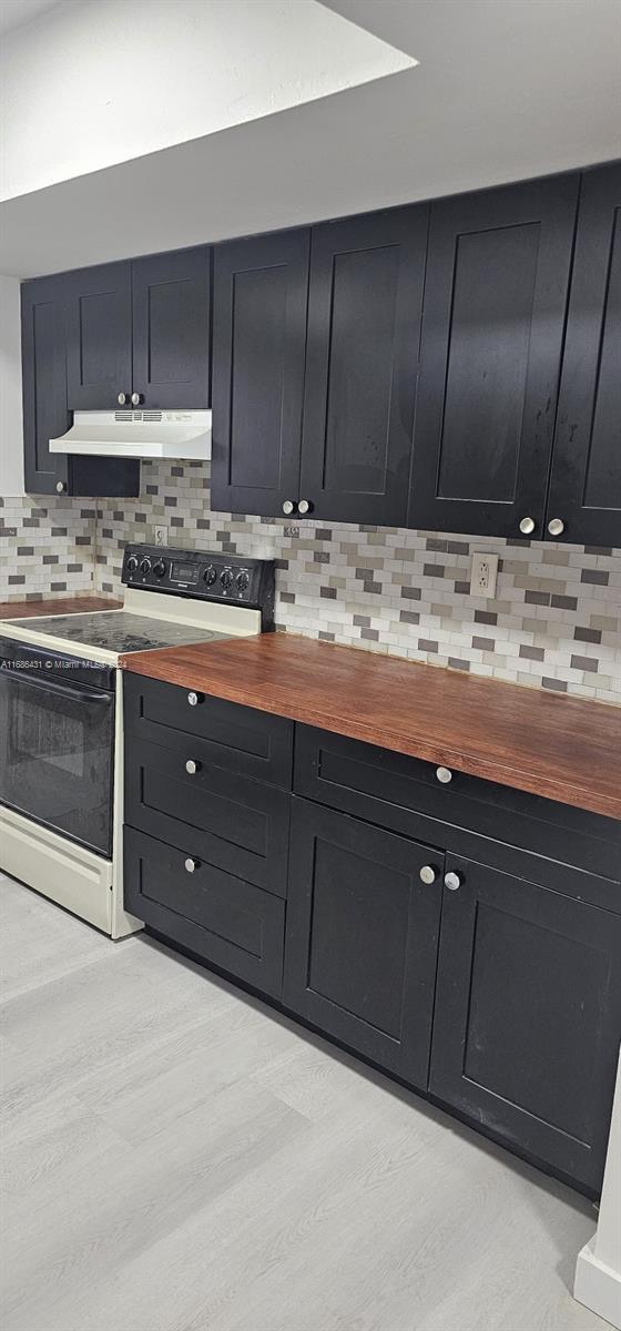 a kitchen with granite countertop cabinets and sink