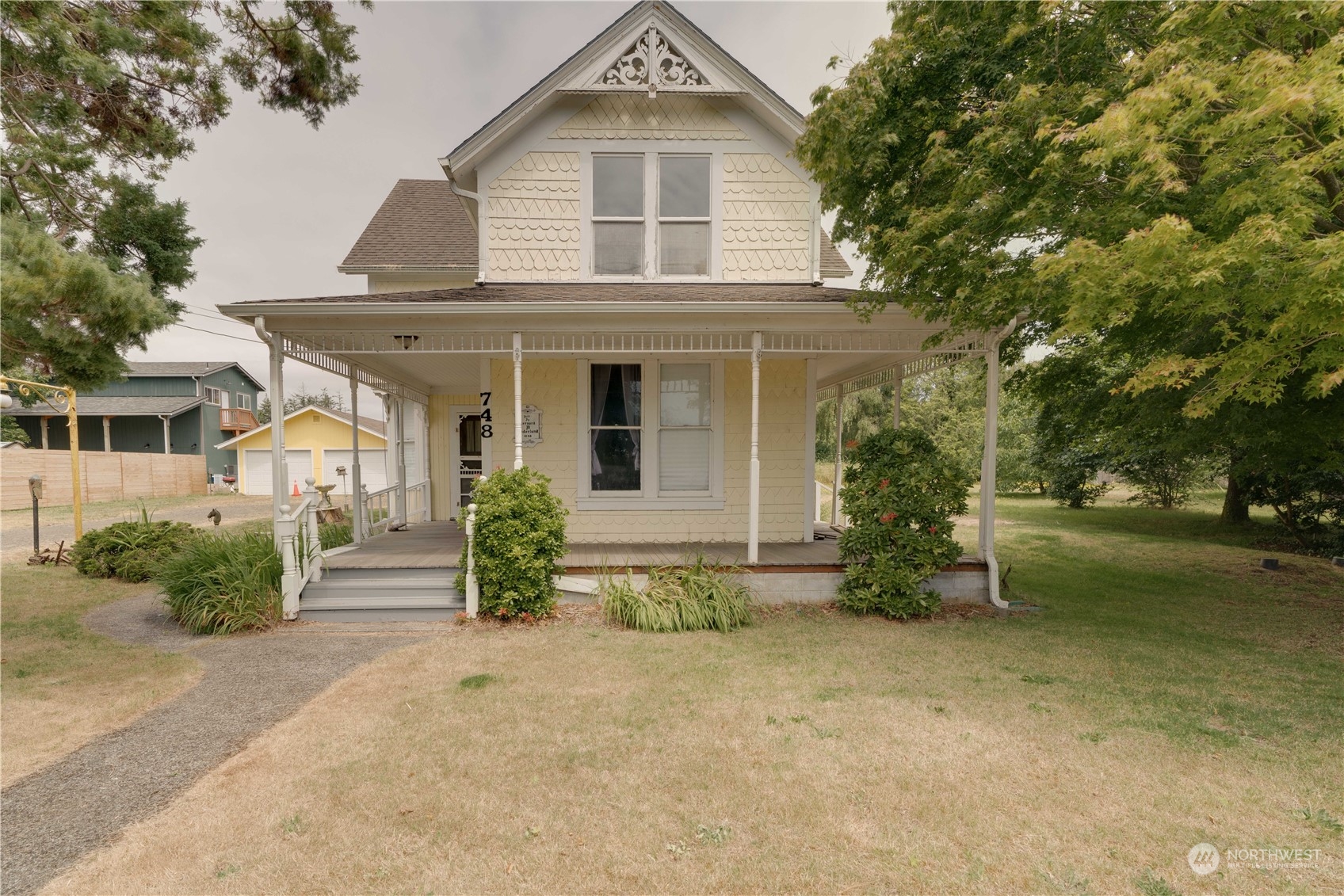 front view of a house with a yard