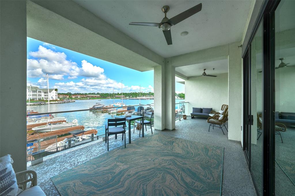 a room with furniture and a floor to ceiling window