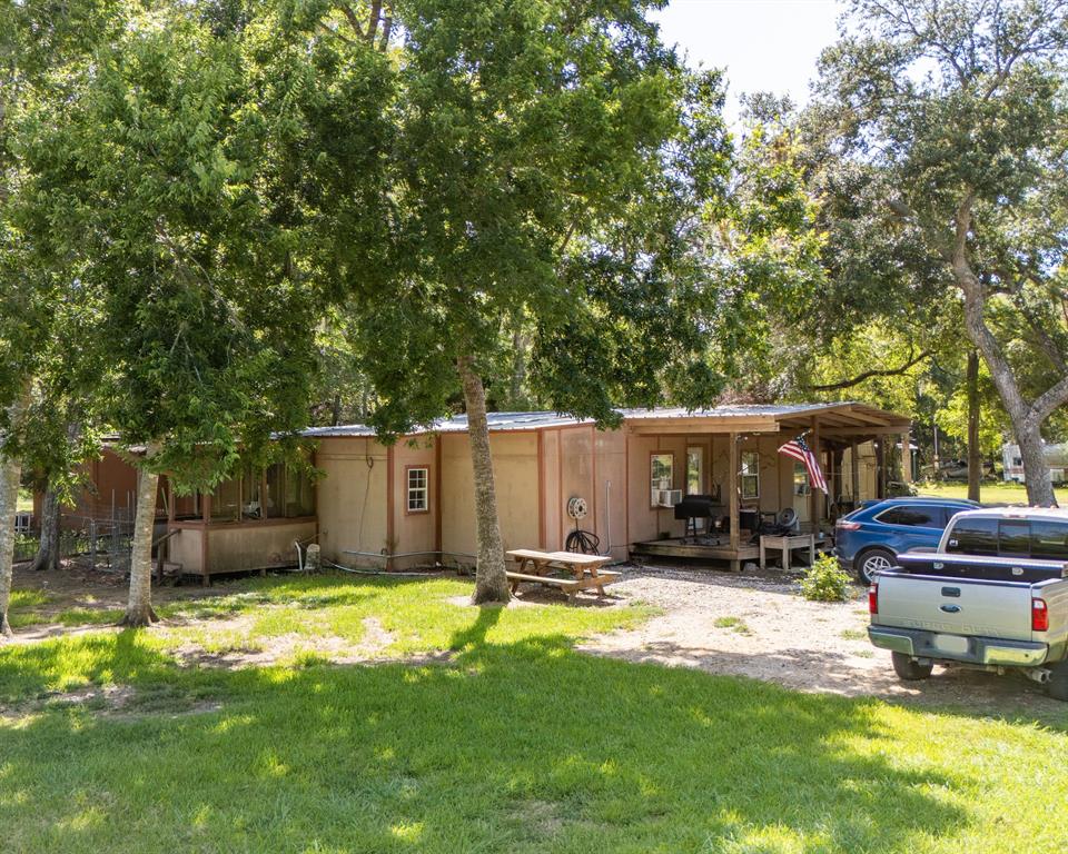 a view of a backyard with parked area