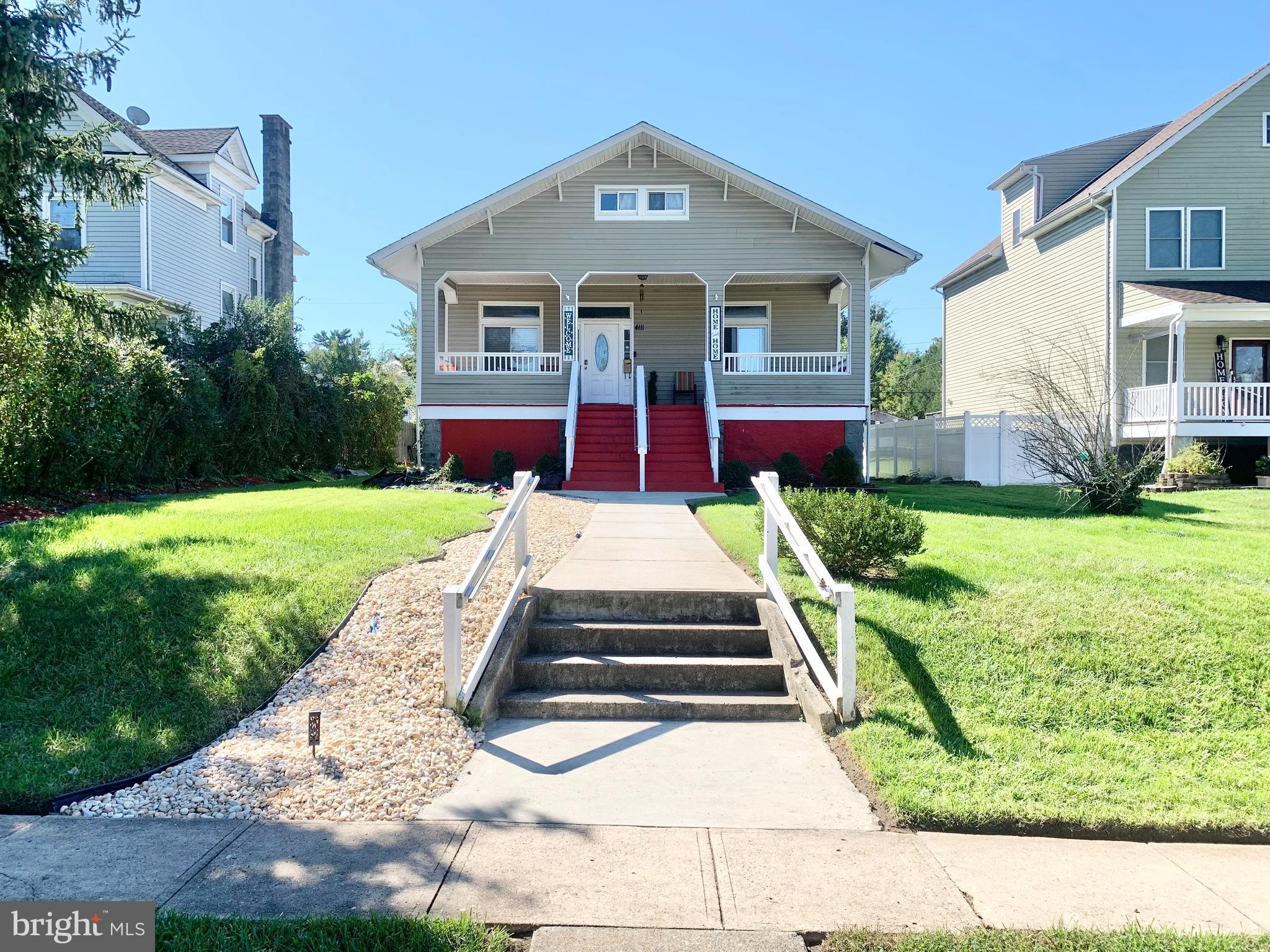 a front view of a house with yard