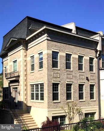 a front view of a house with many windows