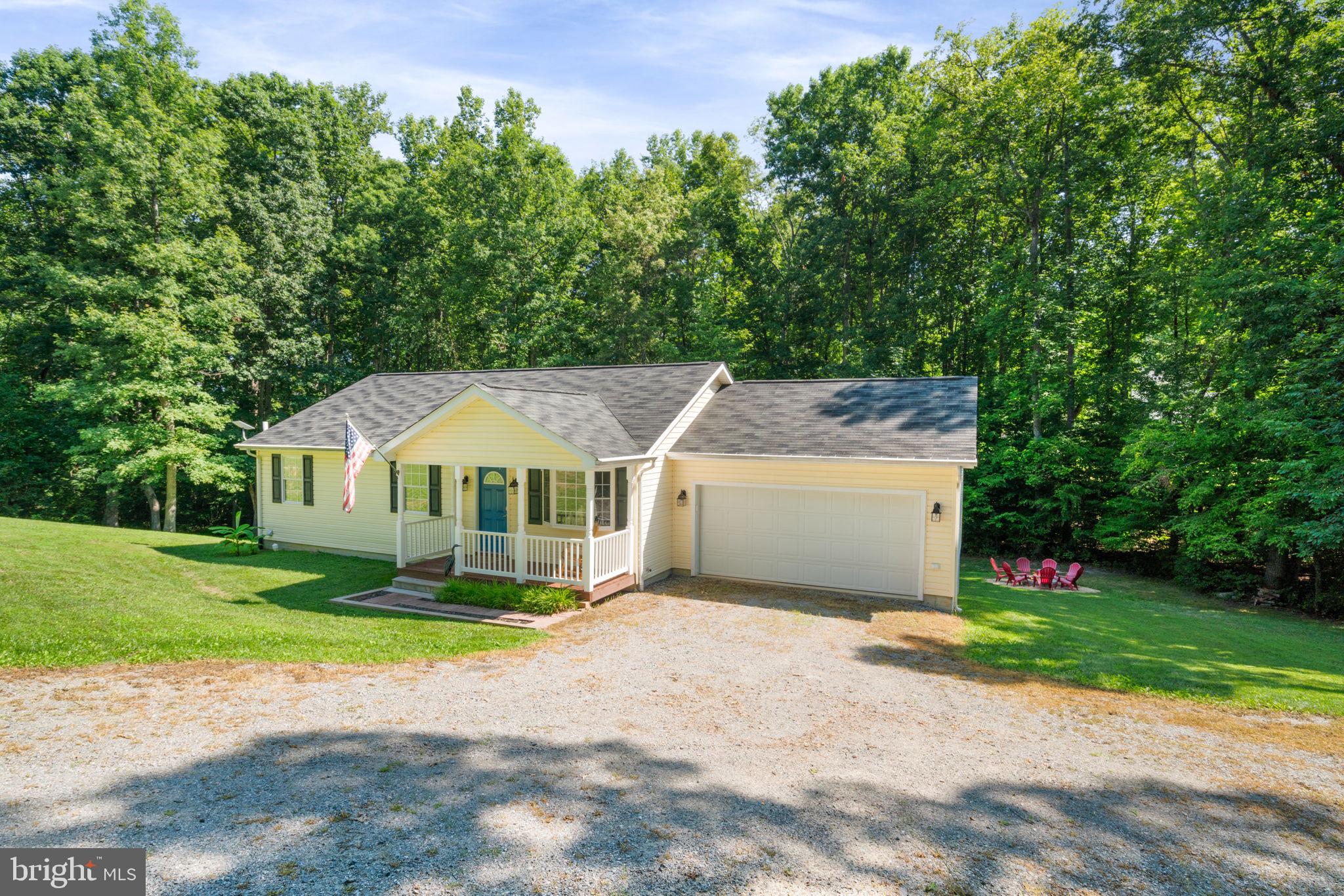 Dreamy covered front porch & 2-car garage