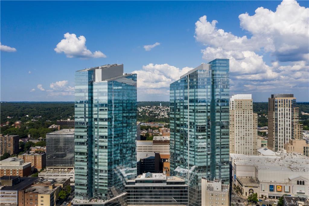 a view of a city with tall buildings