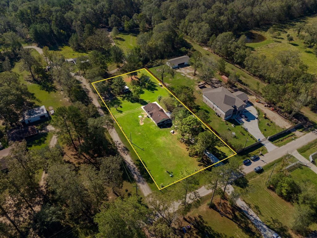 an aerial view of a residential houses with outdoor space