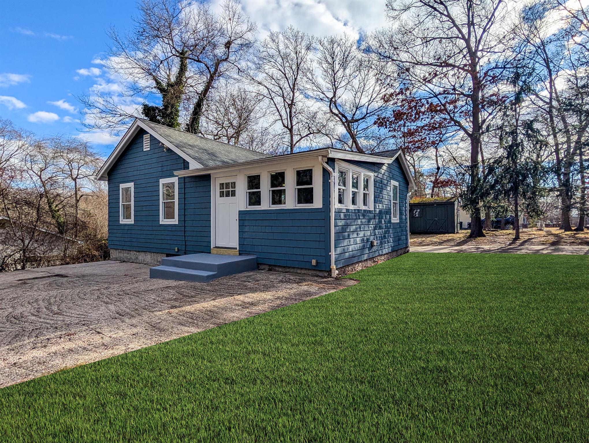 Ranch-style home featuring a front yard