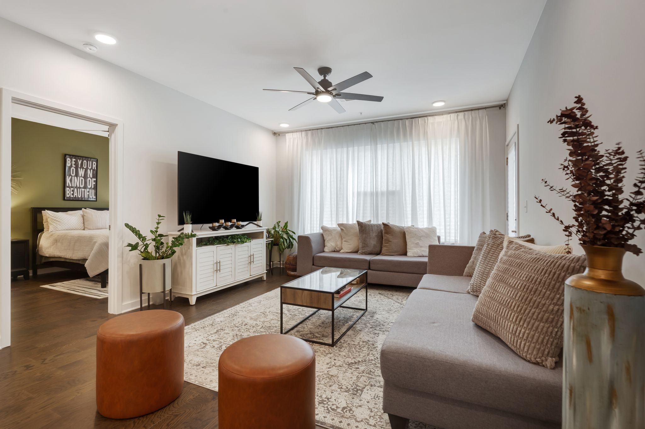 a living room with furniture and a flat screen tv