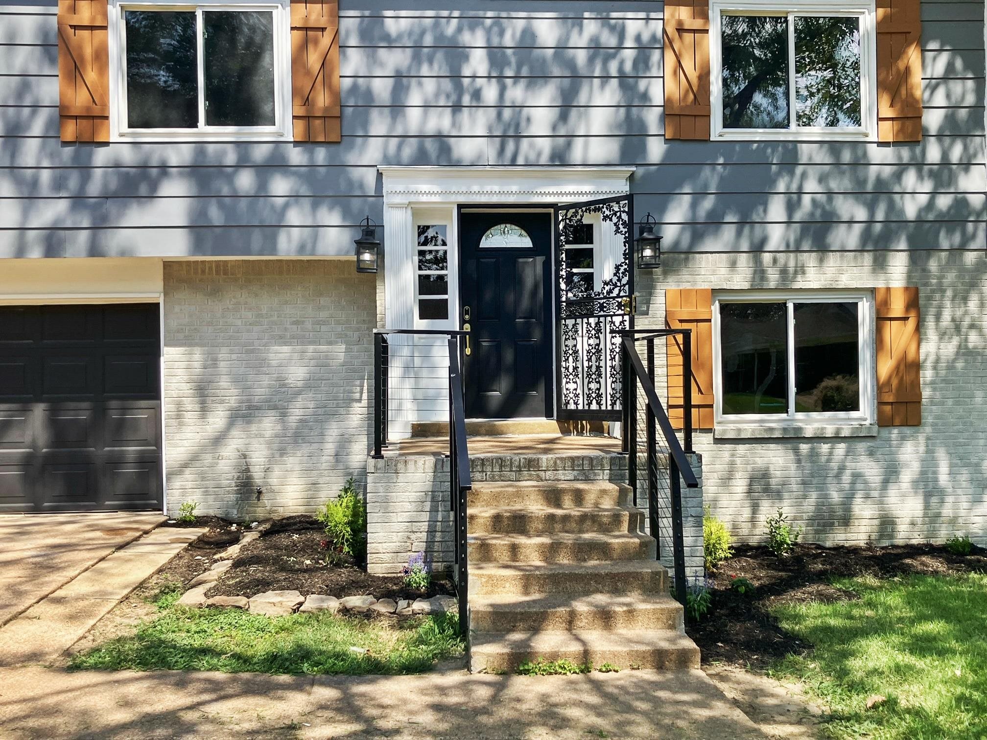 a front view of a house with garden