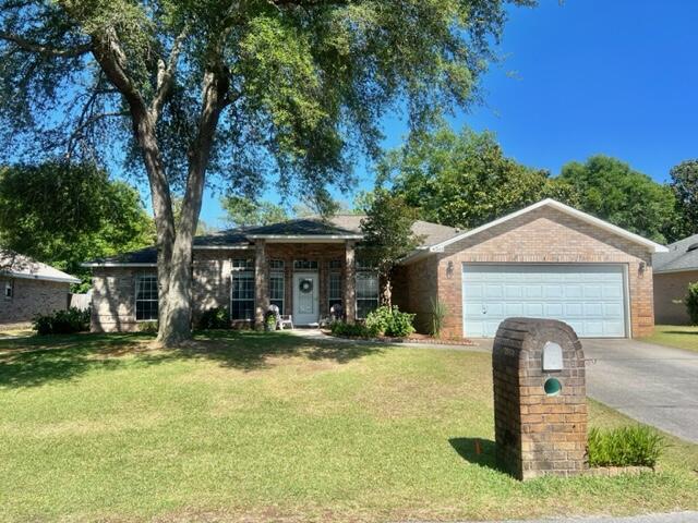 a front view of a house with yard patio and fire pit