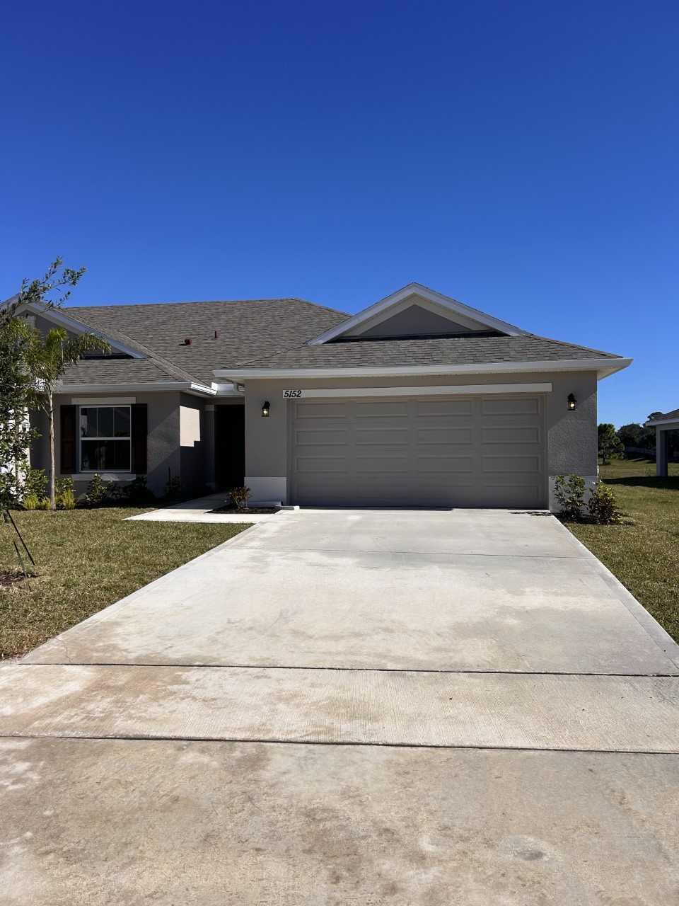 a front view of a house with a garage