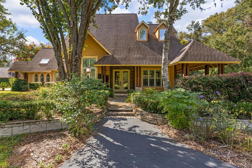 a front view of a house with garden