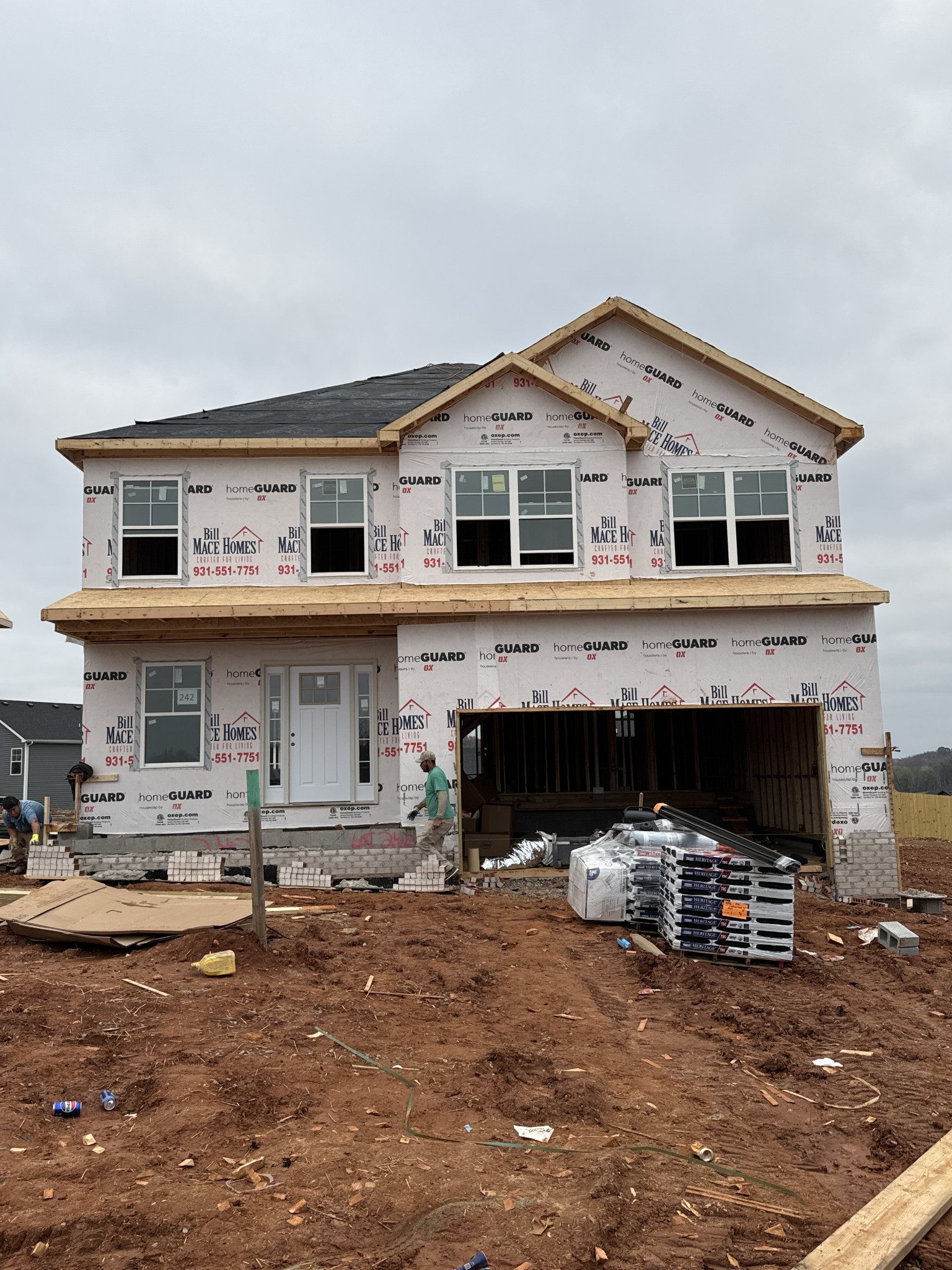 a front view of a house with garage