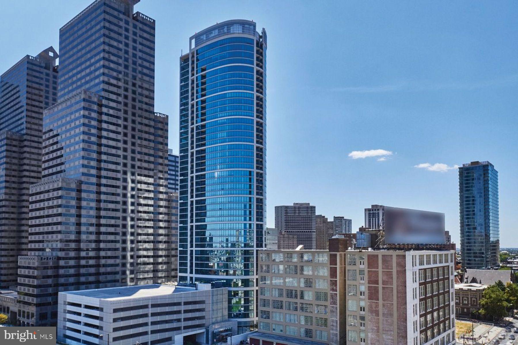 a view of a city with tall buildings